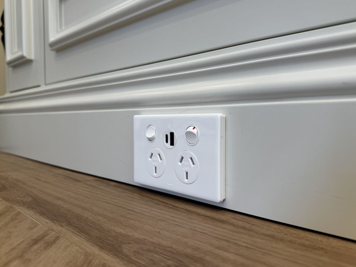 Double power point with USB charging installed in a skirting board