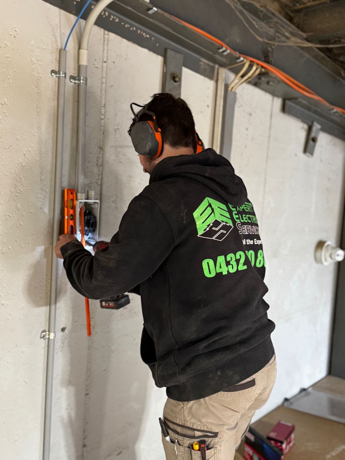 Expert Electrical Services electrician fitting off wiring on site