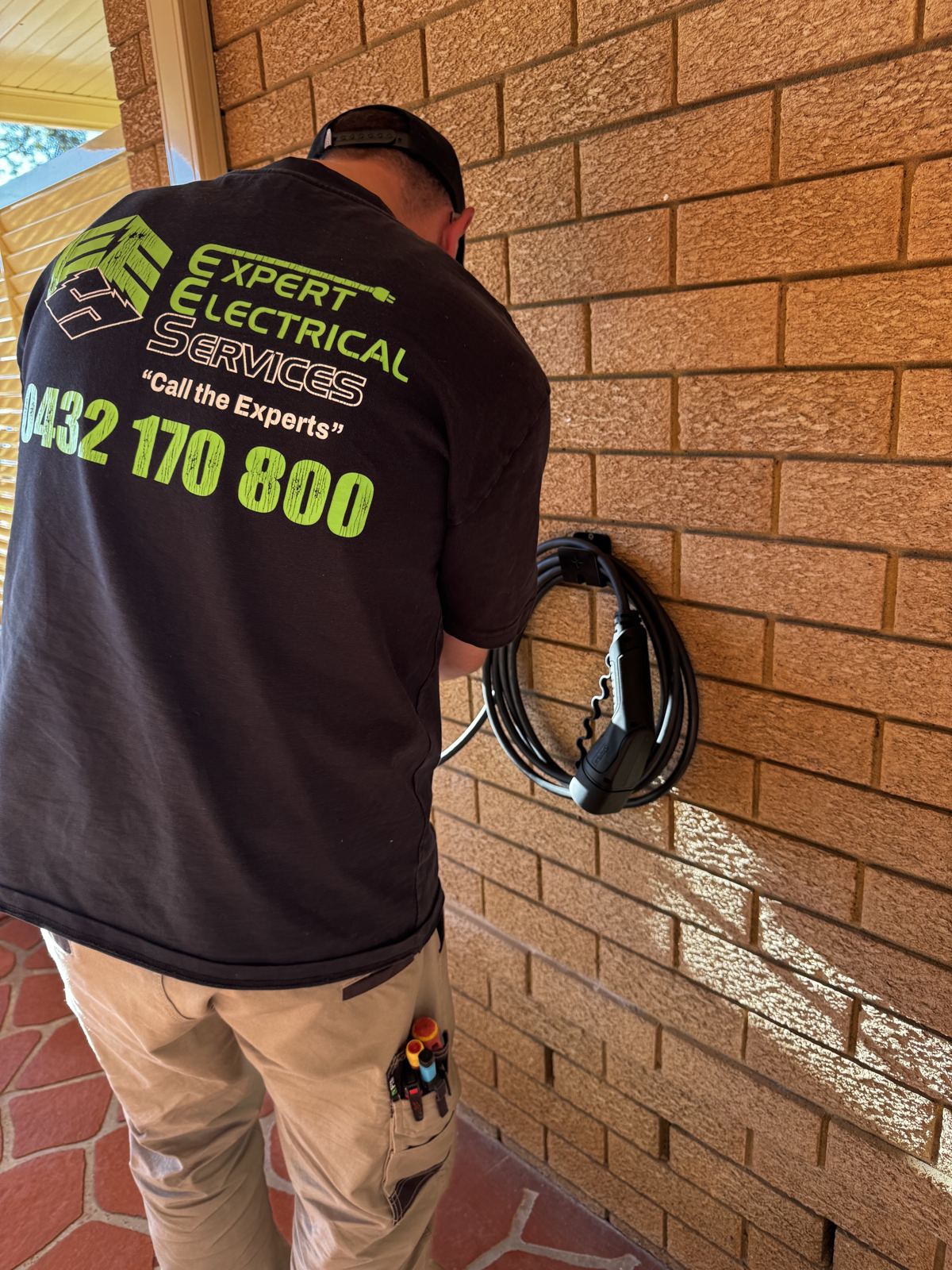 Expert Electrical Services electrician finishing an EV charger install